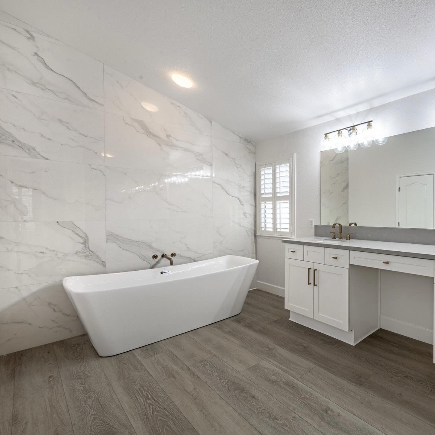 White marble bathroom with freestanding tub